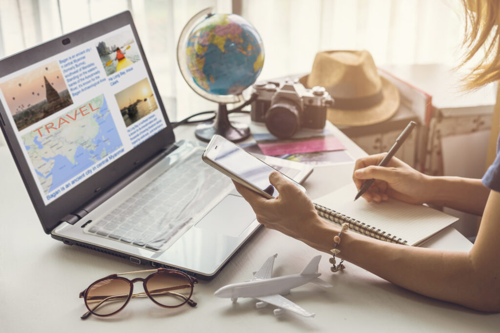 Young women planning vacation trip and searching information